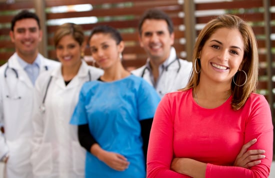 Patient with a group of doctors at the background